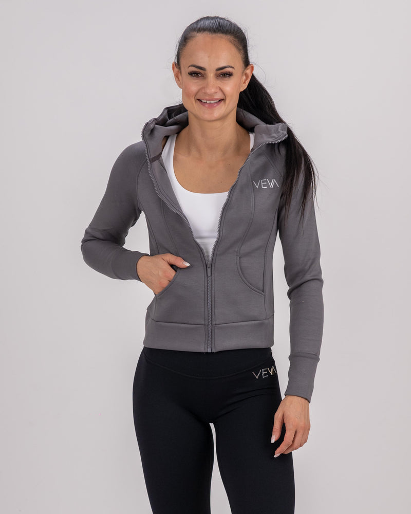 Woman wearing a VEVAwear women's jacket, tailored slim fit in a lifestyle setting